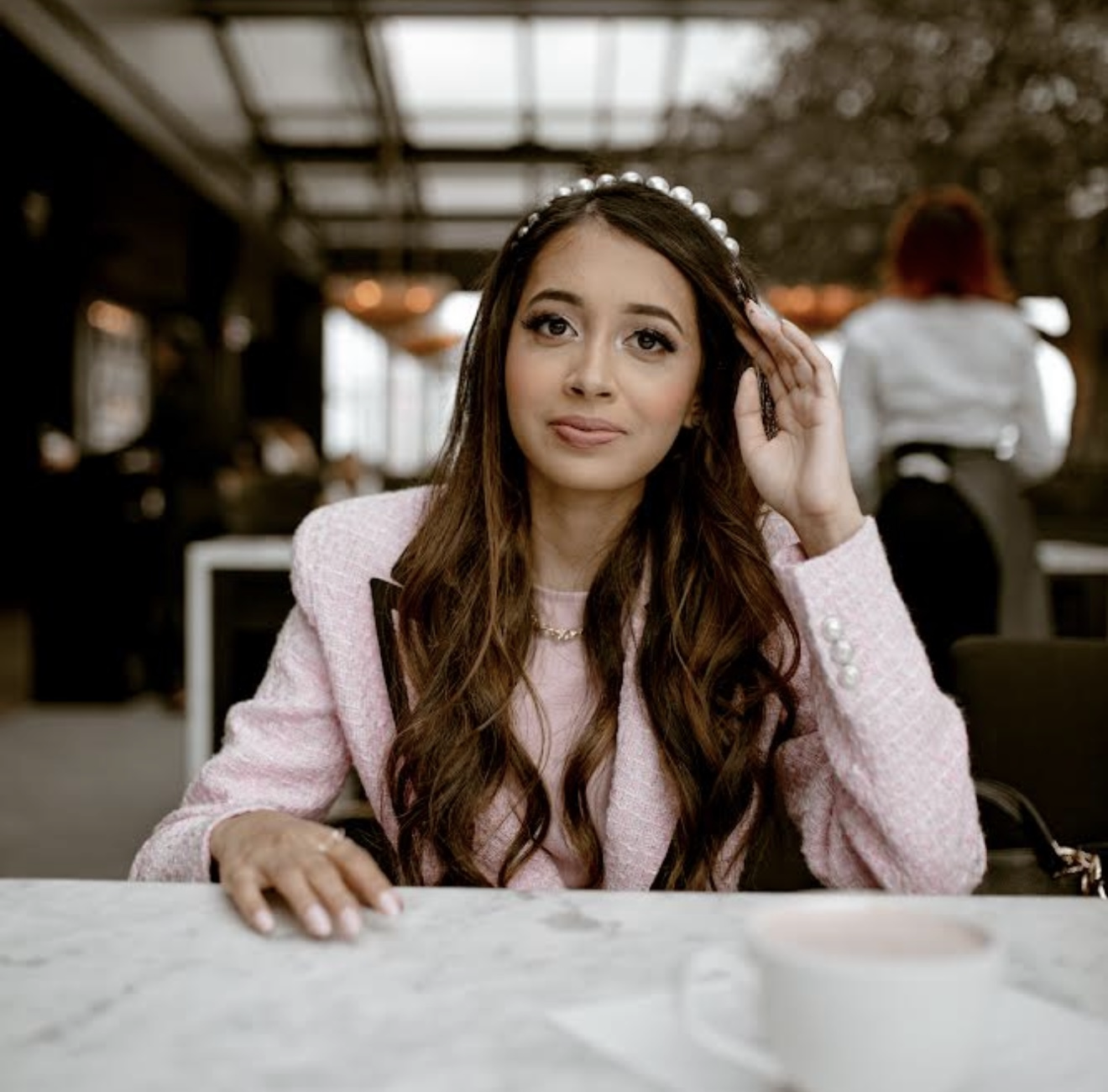 Poonam at a cafe — filling her cup